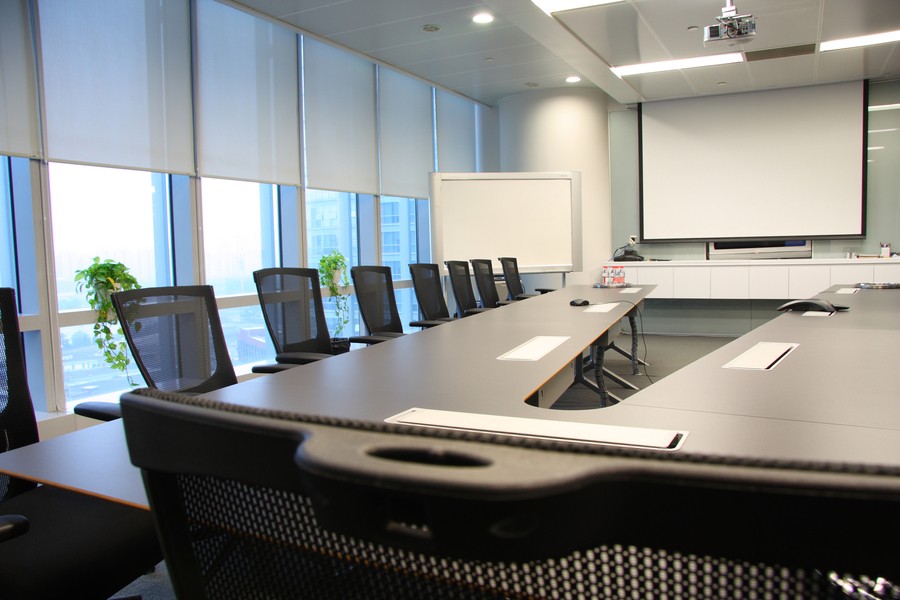 A large meeting room with automation technologies in place.